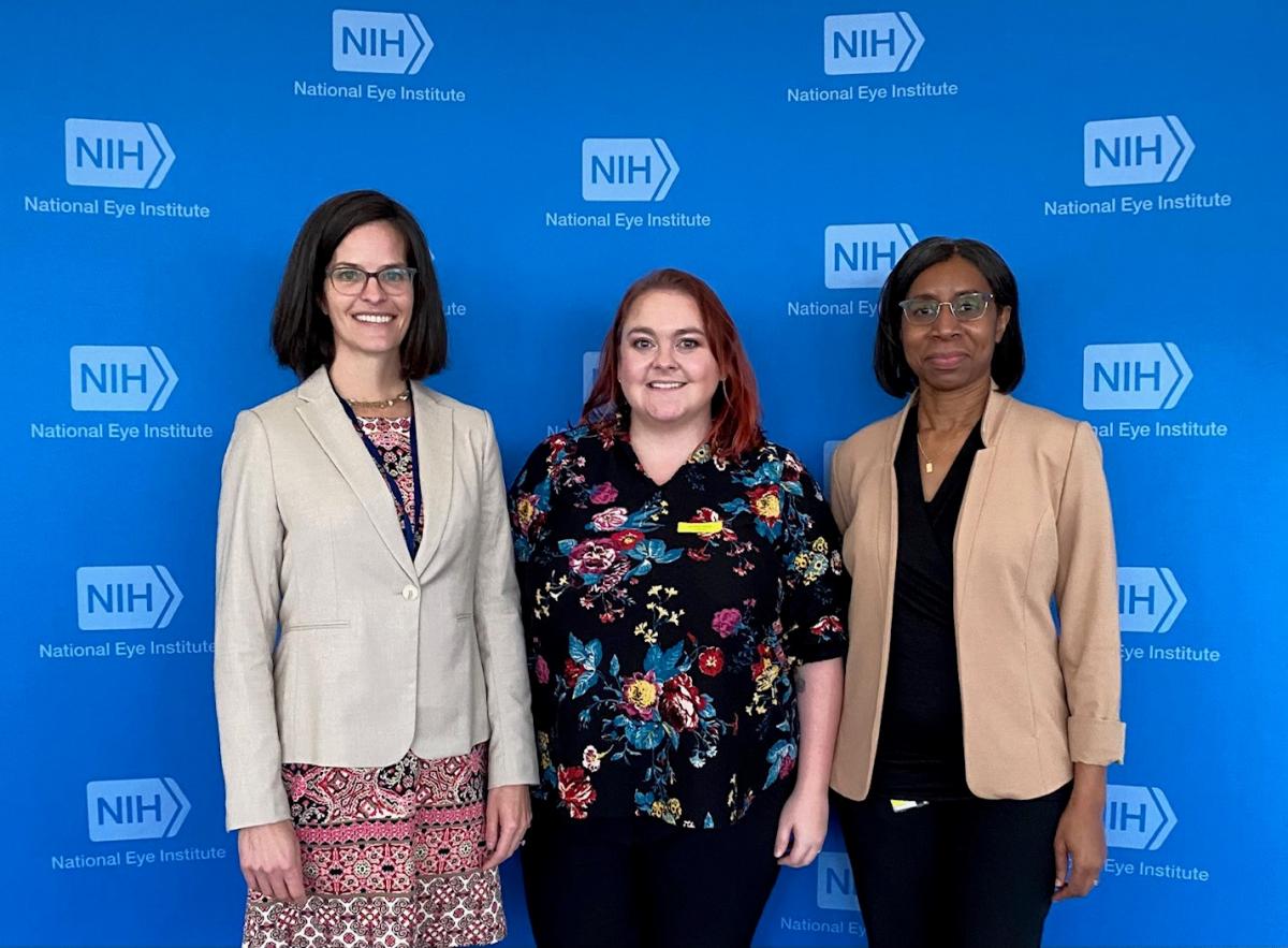 FAES staff with NIH step and repeat